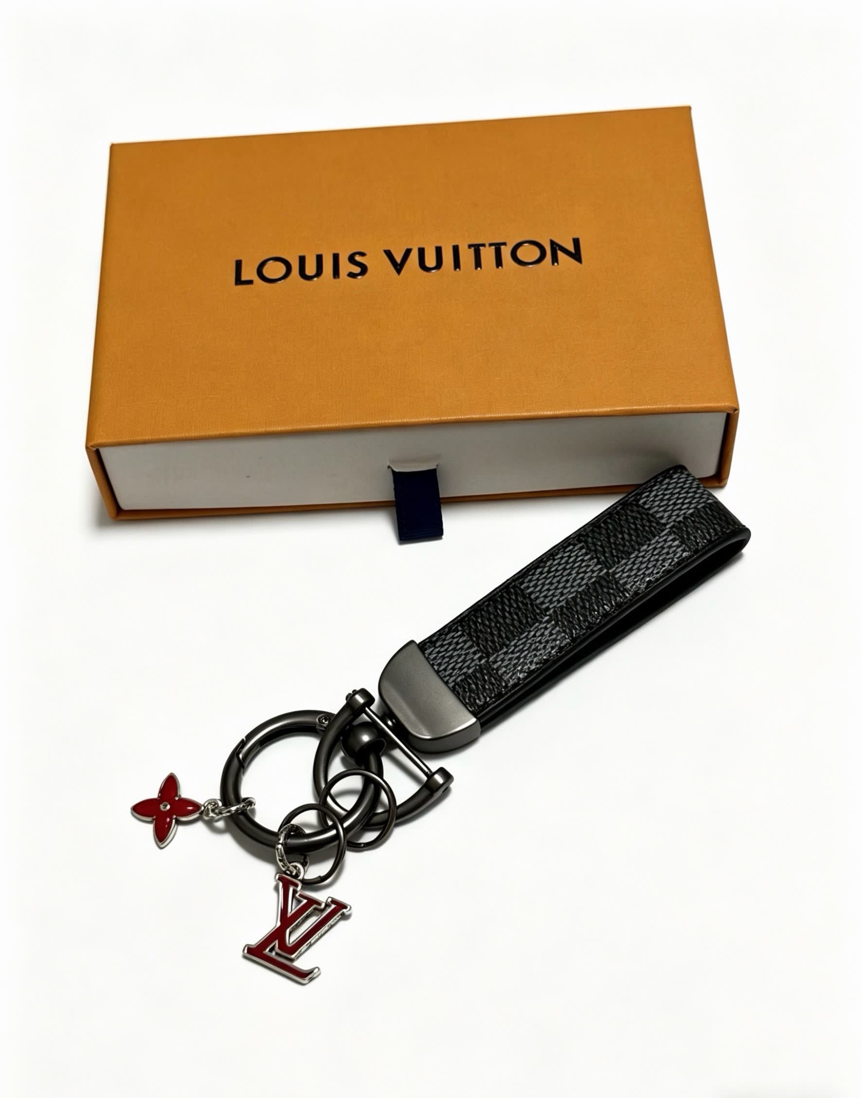 Louis Vuitton Keychain with Monogram Pattern and Logo Charm